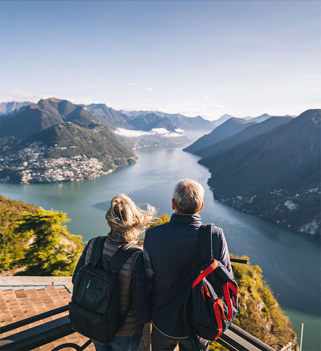 Older couple overlooking river and mountains